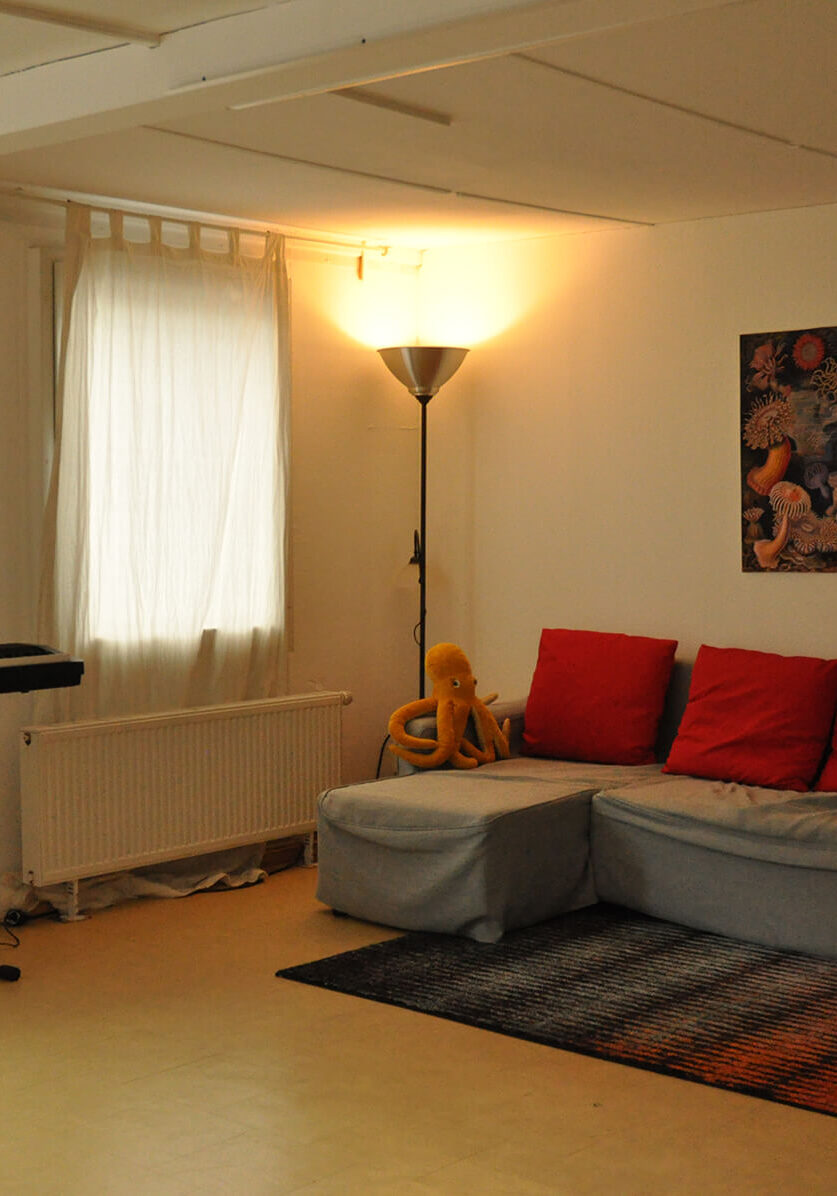 Spark Facilities for Rent - Cozy room with couch and keyboard