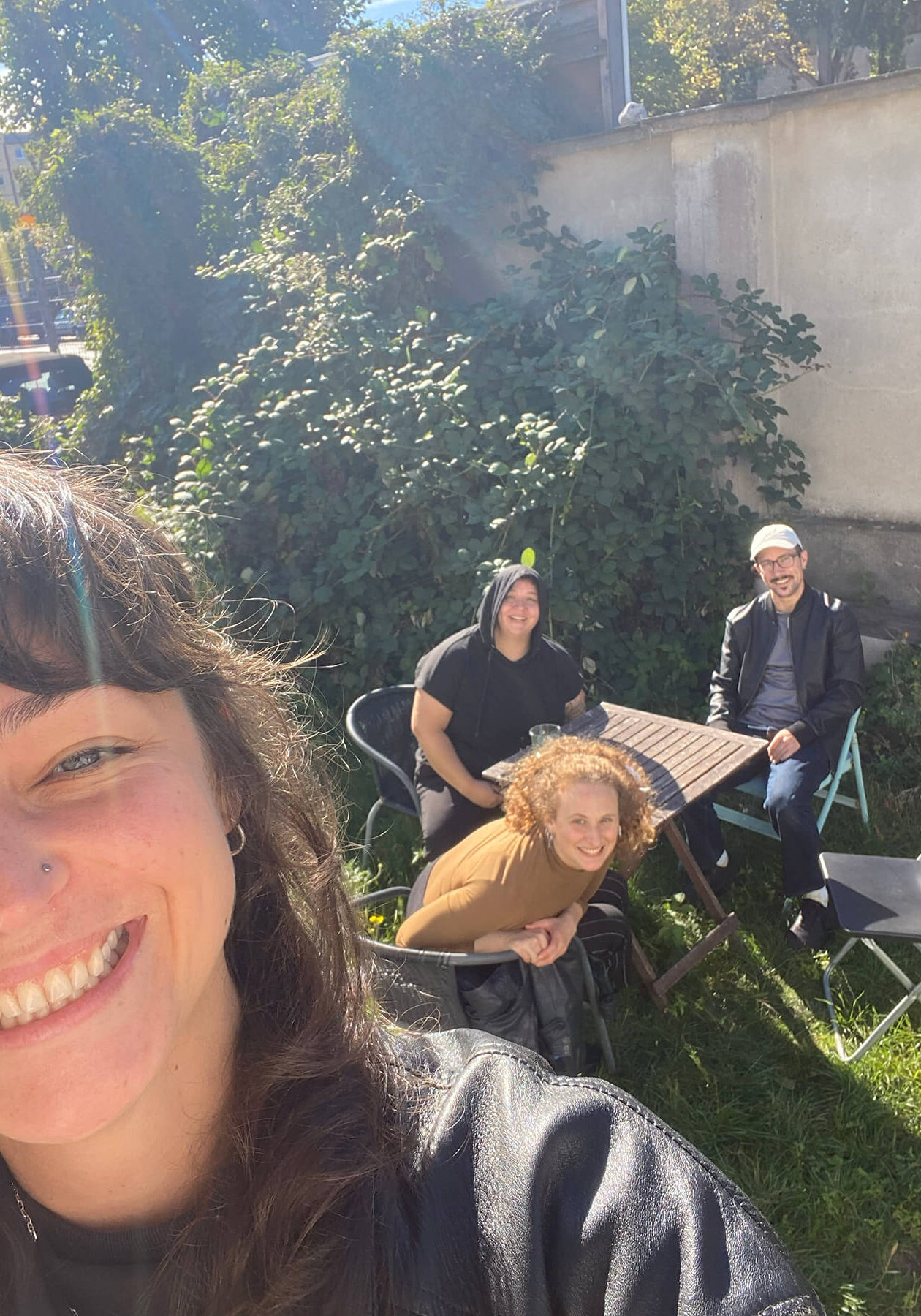 Group selfie at SPARK's Soliday event -- Happy friends outside